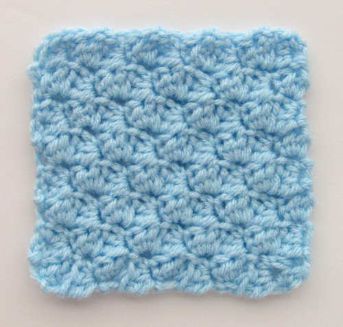 a blue c2c sedge stitch square