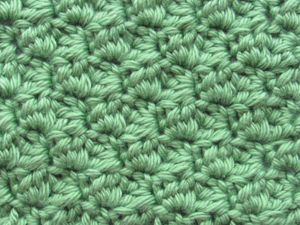 A close-up of a C2C sedge stitch square